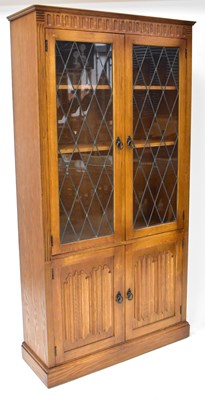 Lot 38 - A reproduction oak leaded and glazed display...