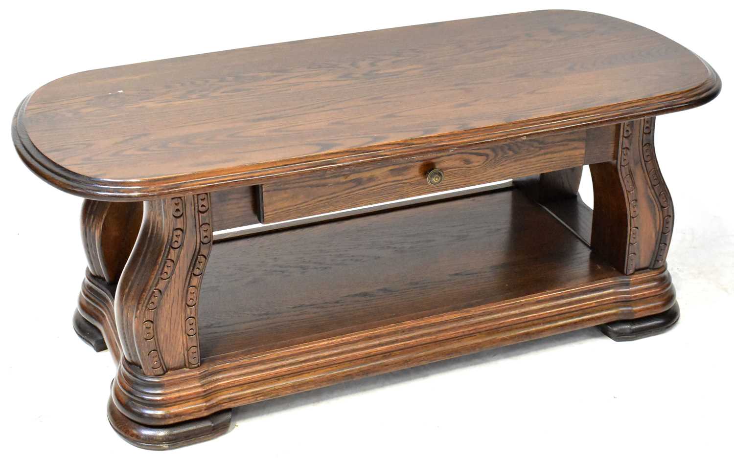 Lot 14 - A 20th century elm coffee table, the plank top...