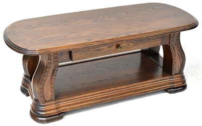 Lot 14 - A 20th century elm coffee table, the plank top...