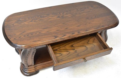 Lot 14 - A 20th century elm coffee table, the plank top...