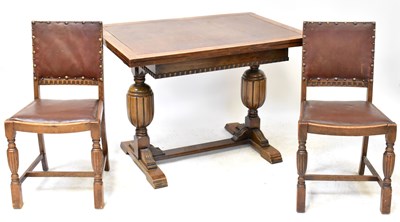 Lot 10 - A 1930s oak refectory-style extending dining...