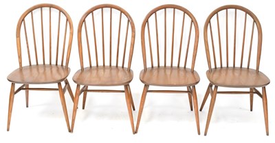 Lot 6 - ERCOL; a mid-coloured elm circular extending...