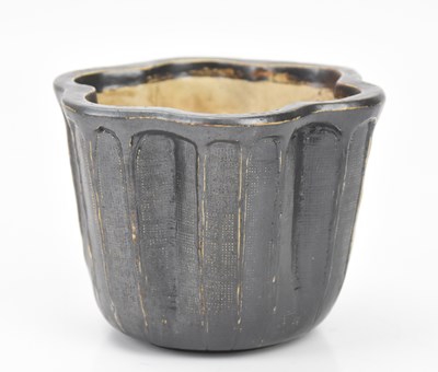 Lot 375 - MARTIN BROS; an Art Pottery planter of shaped...