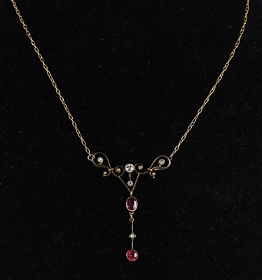 Lot 1476 - An Edwardian yellow metal Art Nouveau ruby and...