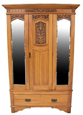 Lot 54 - An Edwardian satinwood wardrobe with central...