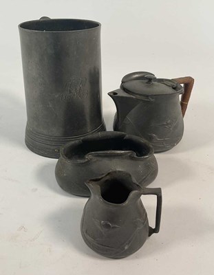 Lot 128 - A pewter tankard, height 15.5cm, together with...