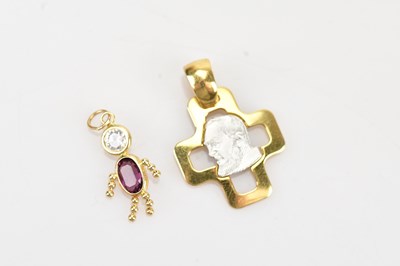 Lot 350 - A yellow and white metal cross pendant with a...