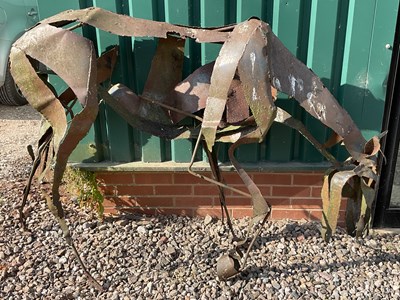 Lot 19 - A rustic metal garden sculpture of a horse...