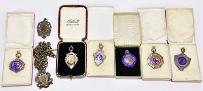 Lot 1221 - A group of four hallmarked silver football...