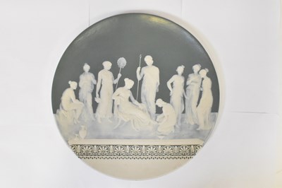 Lot 166 - METTLACH; a circular wall plaque, moulded with...