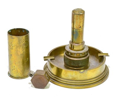 Lot 1096 - A Trench Art ashtray lighter, a lighter and a...