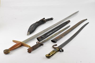 Lot 605 - A Chasepot bayonet, the guard and scabbard...