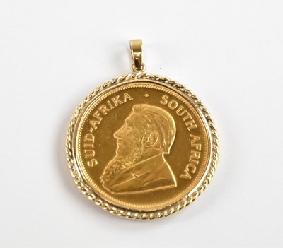 Lot 919 - A gold Krugerrand 1978, with a yellow metal...