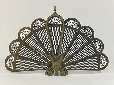 Lot 123 - A brass peacock firescreen fireguard, height...