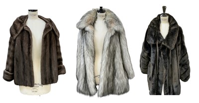 Lot 665 - Three early 20th century and later fur coats,...