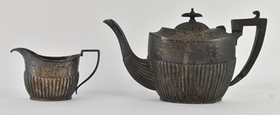 Lot 1112 - An Edward VII hallmarked silver teapot, with...
