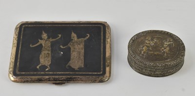 Lot 1195 - An early 20th century Thai white metal niello...