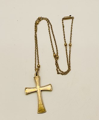 Lot 485 - A 9ct yellow gold cross pendant on a 9ct...