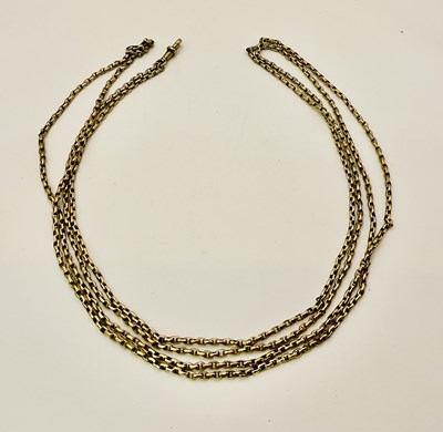 Lot 438 - A long yellow metal watch chain, length approx...