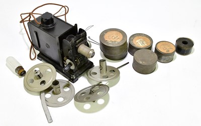 Lot 1132 - A winding projector and film.
