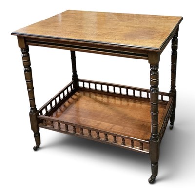 Lot 144 - An Edwardian mahogany and ebonised two tiered...