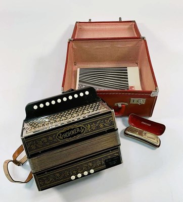 Lot 283 - HOHNER; a German melodeon, with four keys to...
