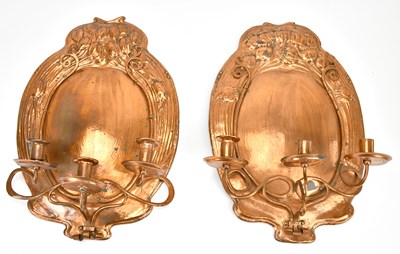Lot 454 - A pair of art nouveau copper wall sconces with...