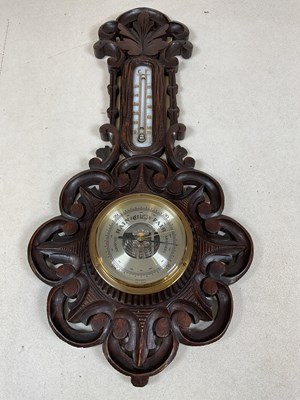 Lot 636 - A carved wood barometer, made in Germany,...