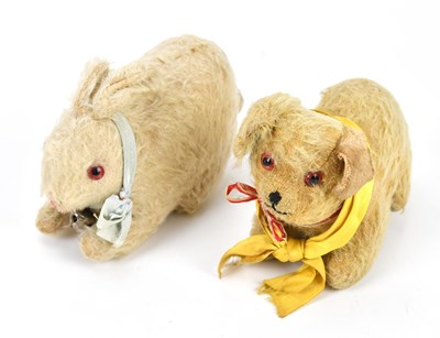Lot 1816 - A vintage plush model of a dog, length 13cm,...