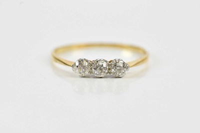 Lot 469A - A yellow metal diamond three stone dress ring,...