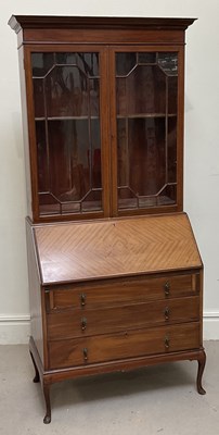 Lot 107 - An Edwardian mahogany bureau bookcase, the...