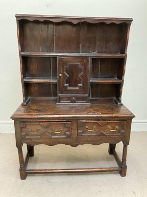 Lot 58 - A small antique oak Welsh dresser with boarded...