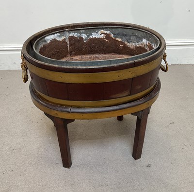 Lot 146 - A Georgian mahogany and brass bound wine...