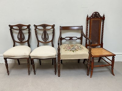 Lot 148 - A 19th century open sided elbow chair with...