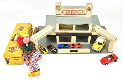 Lot 1820 - A vintage wooden model of a garage, a cased...