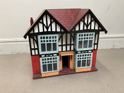 Lot 1830 - A vintage doll's house formed as a Tudoresque...