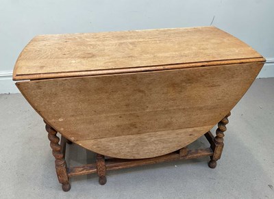 Lot 159 - A 1920s oak drop-leaf dining table, length 109cm.