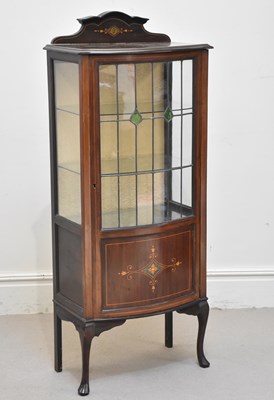 Lot 1263 - An Edwardian inlaid bowfront display cabinet,...