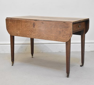 Lot 1276 - A 19th century oak Pembroke table with end...