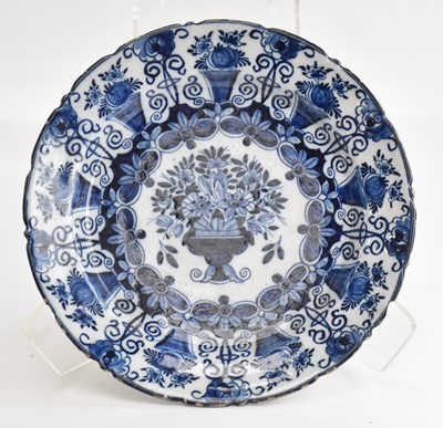 Lot 1533 - A Dutch Delft charger, with scalloped rim and...