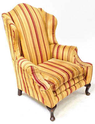 Lot 34 - A 19th century wingback armchair, with...