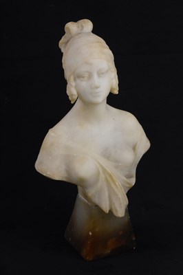 Lot 151 - An Art Deco carved alabaster bust on tapering...