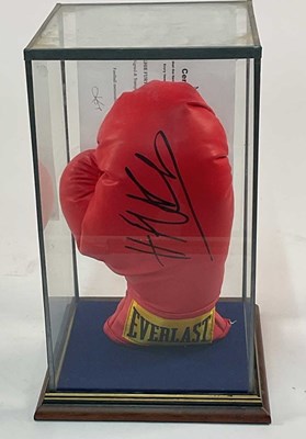 Lot 118 - A red Everlast boxing glove signed by Hughie...