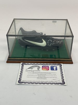 Lot 112 - A Dennis Tueart signed football boot, with...