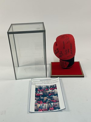 Lot 115 - A boxing glove signed by various boxers to...