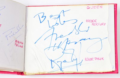 Lot 302 - An autograph book, containing multiple...