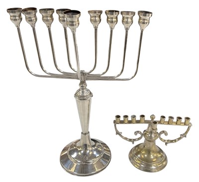 Lot 1083 - JUDAICA; a silver plated menorah, with...