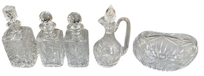 Lot 833 - Four cut glass decanters, one with handle,...