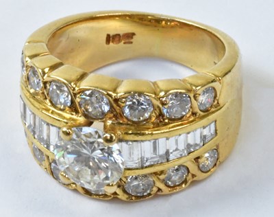 Lot 760 - An 18ct yellow gold ring set with a central...