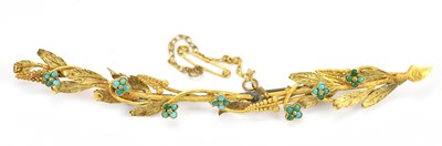 Lot 678 - An unusual yellow metal turquoise set crescent...